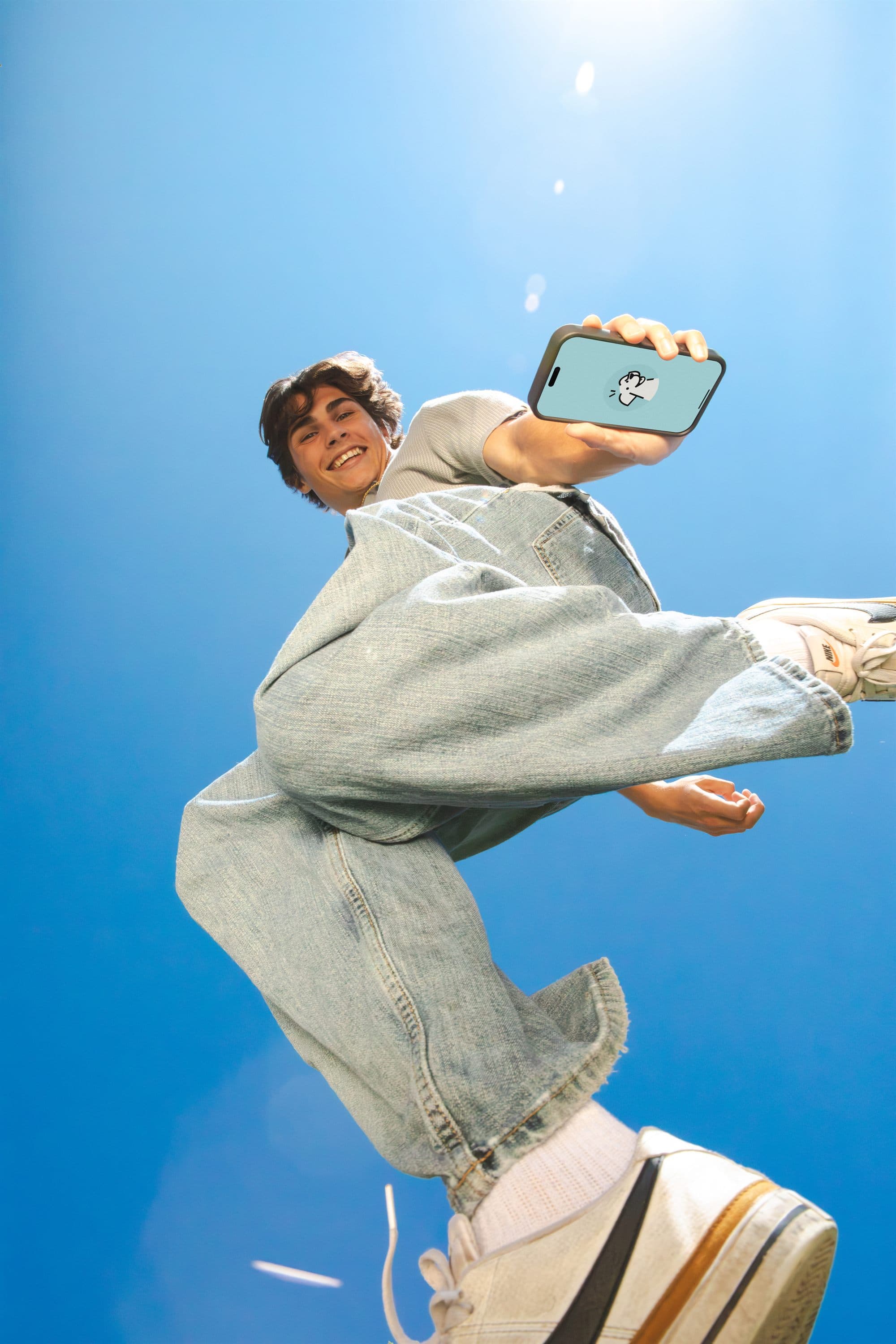StudyFetch creator jumping with a phone